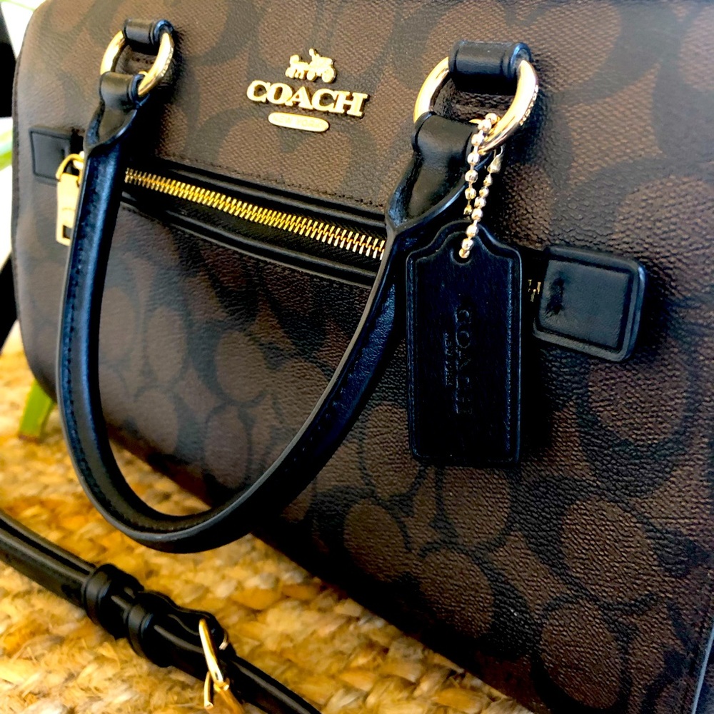 Coach purse, like new, black with deep brown. No dust bag or tags.